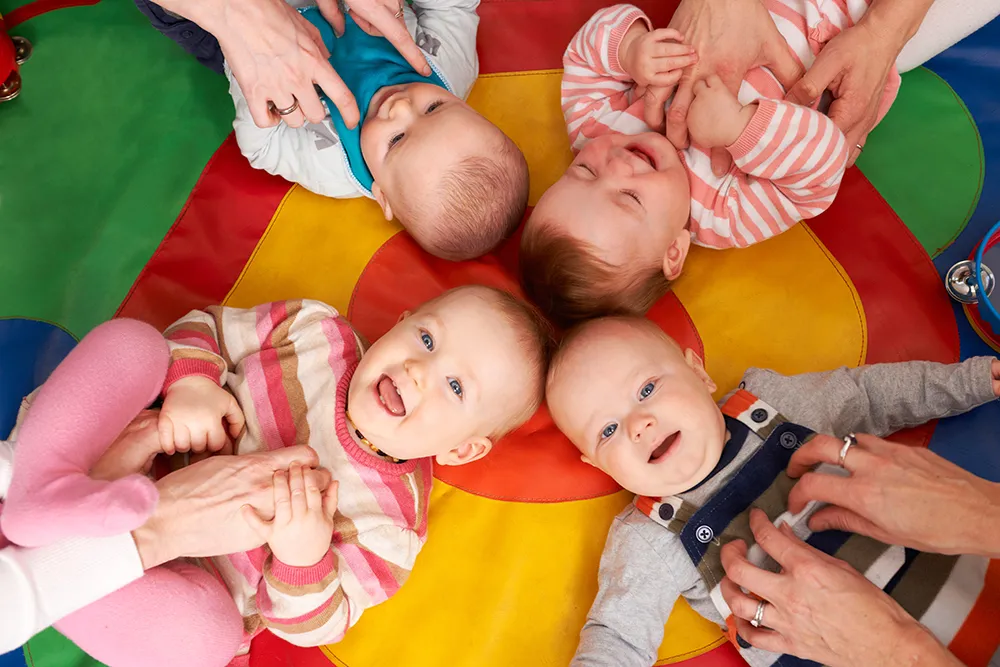 Overhead View Of Babies Having Fun At Nursery